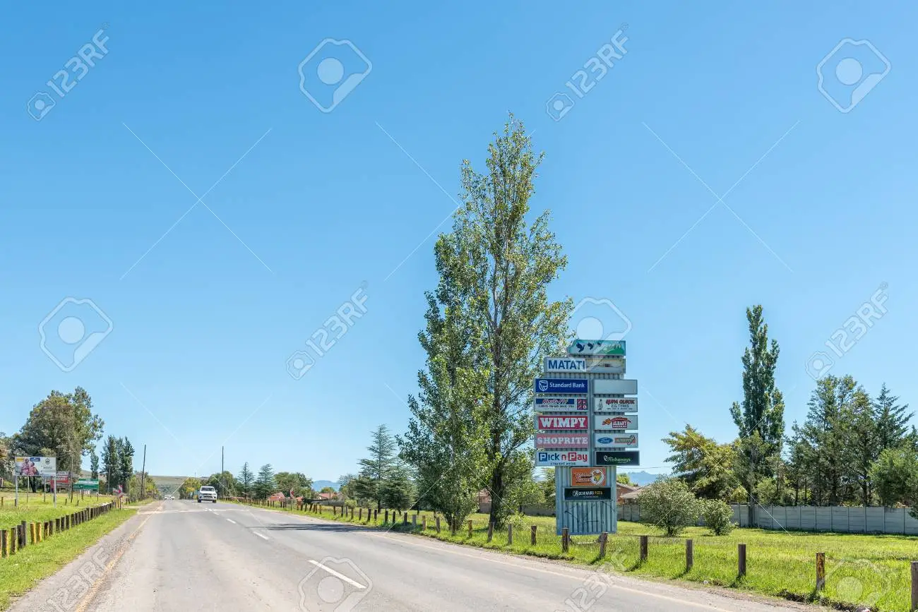 104320974 matatiele south africa march 26 2018 a street scene with billboards and a vehicle in matatiele in th