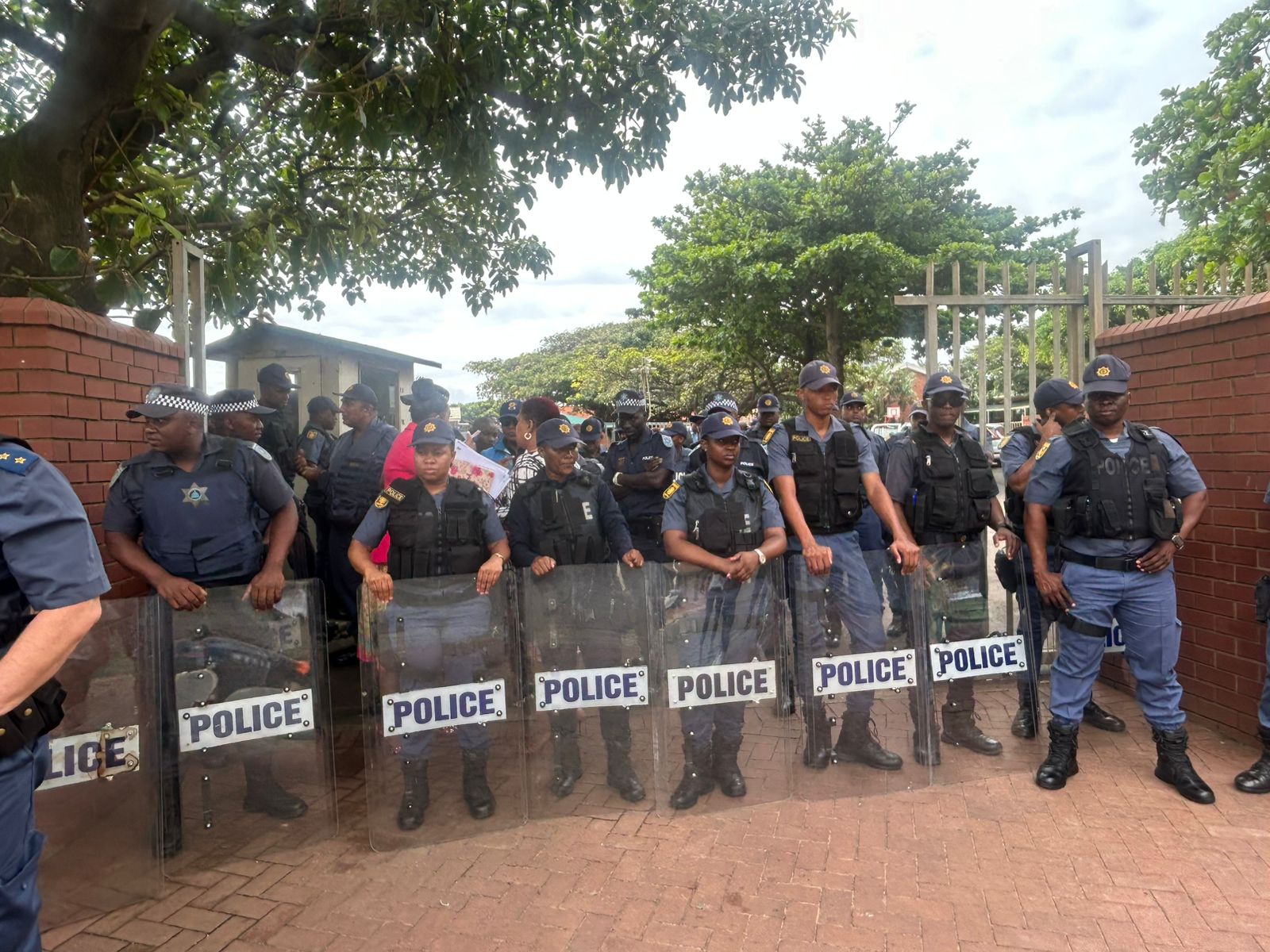 Police deployed outside Addington Primary school as tensions escalate